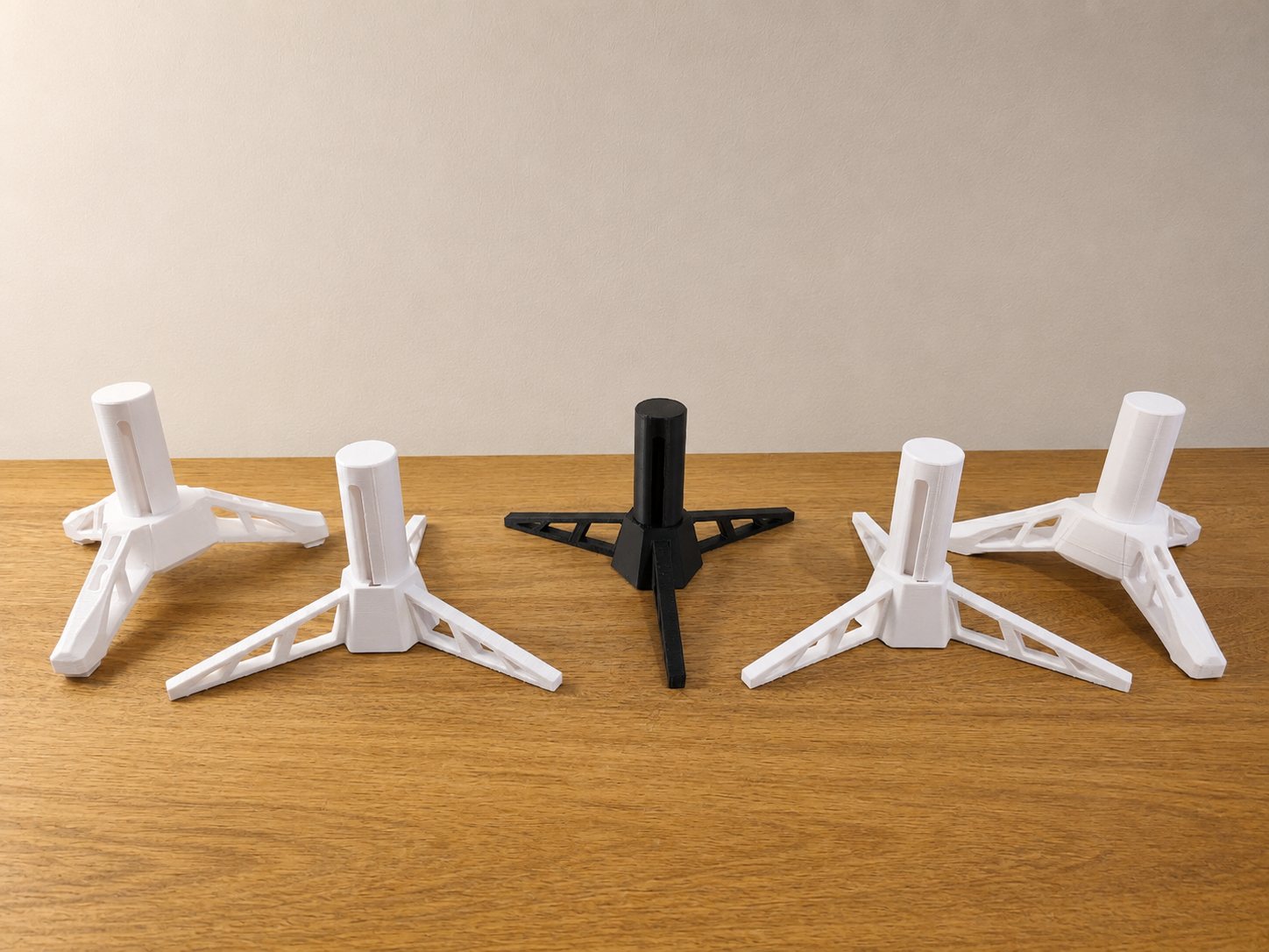 ITERA tabletop tripod display stands in white and black
