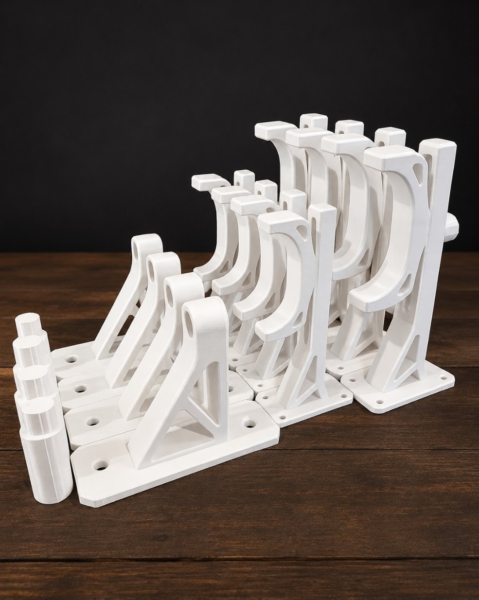 The ITERA wall mount family in multiple sizes on a dark wood surface