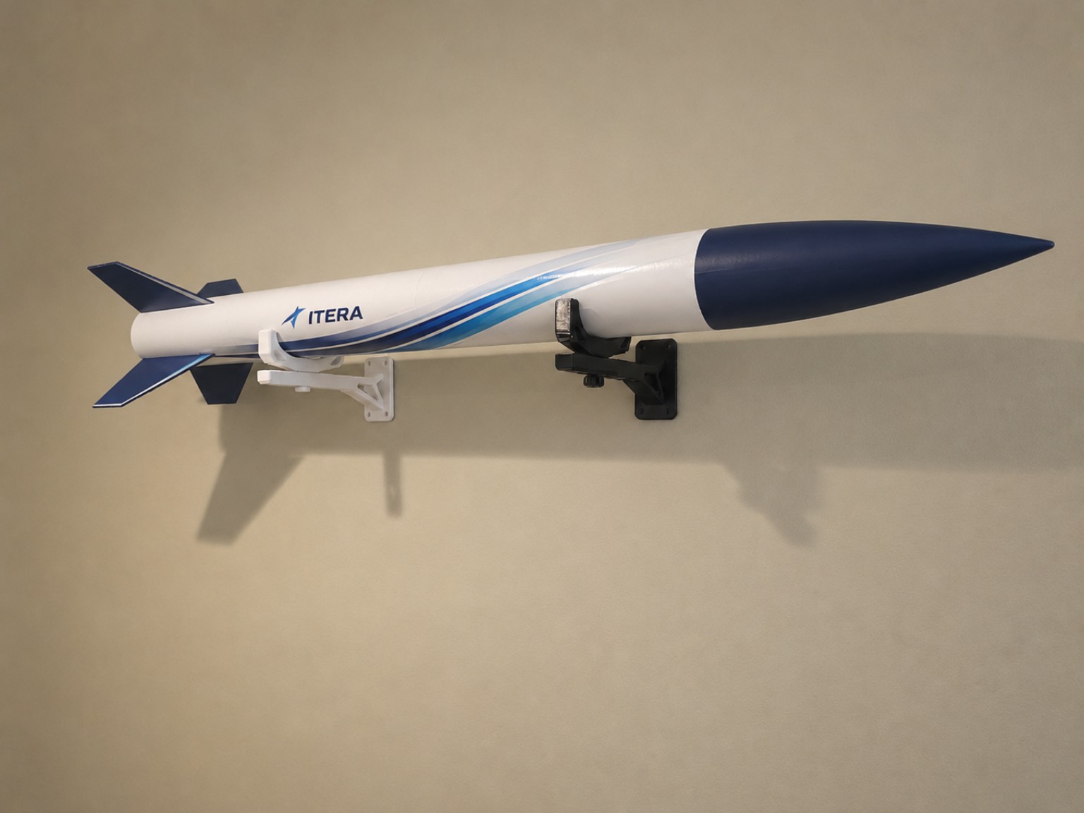 Model rocket displayed on ITERA wall mounts