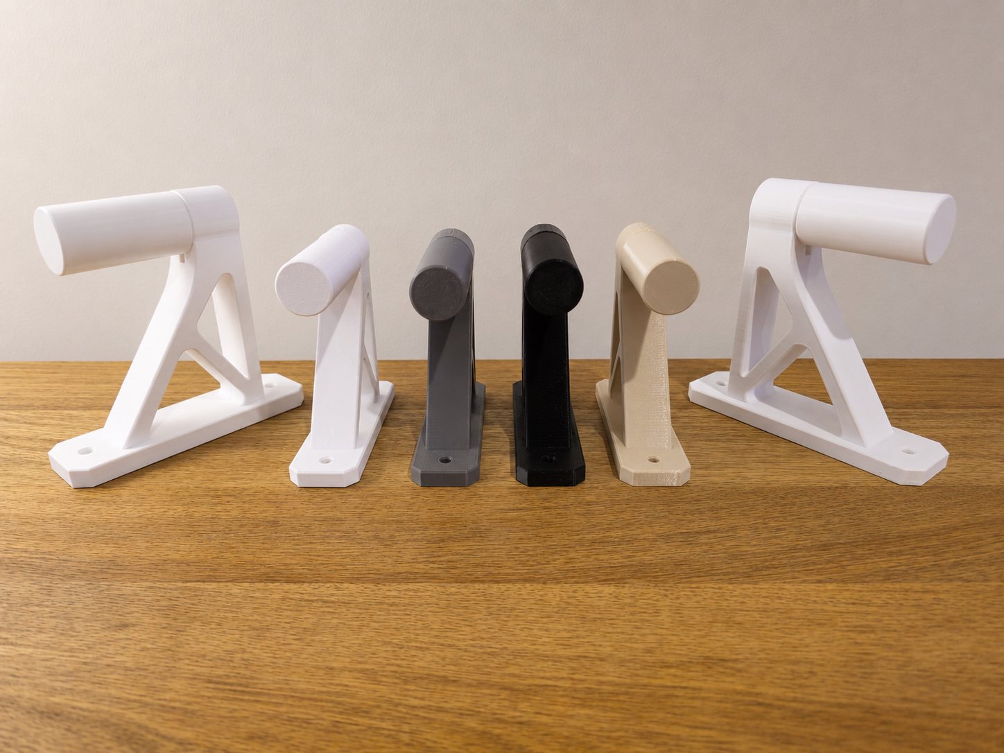 ITERA single rocket wall mounts in white, gray, black, and tan