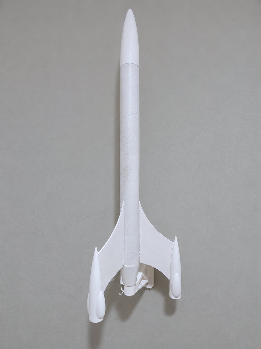 Model rocket displayed vertically on the ITERA truss bracket