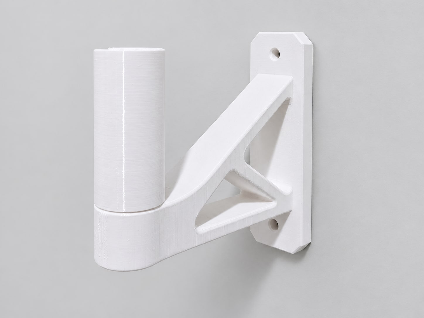 White truss wall bracket with an upright peg
